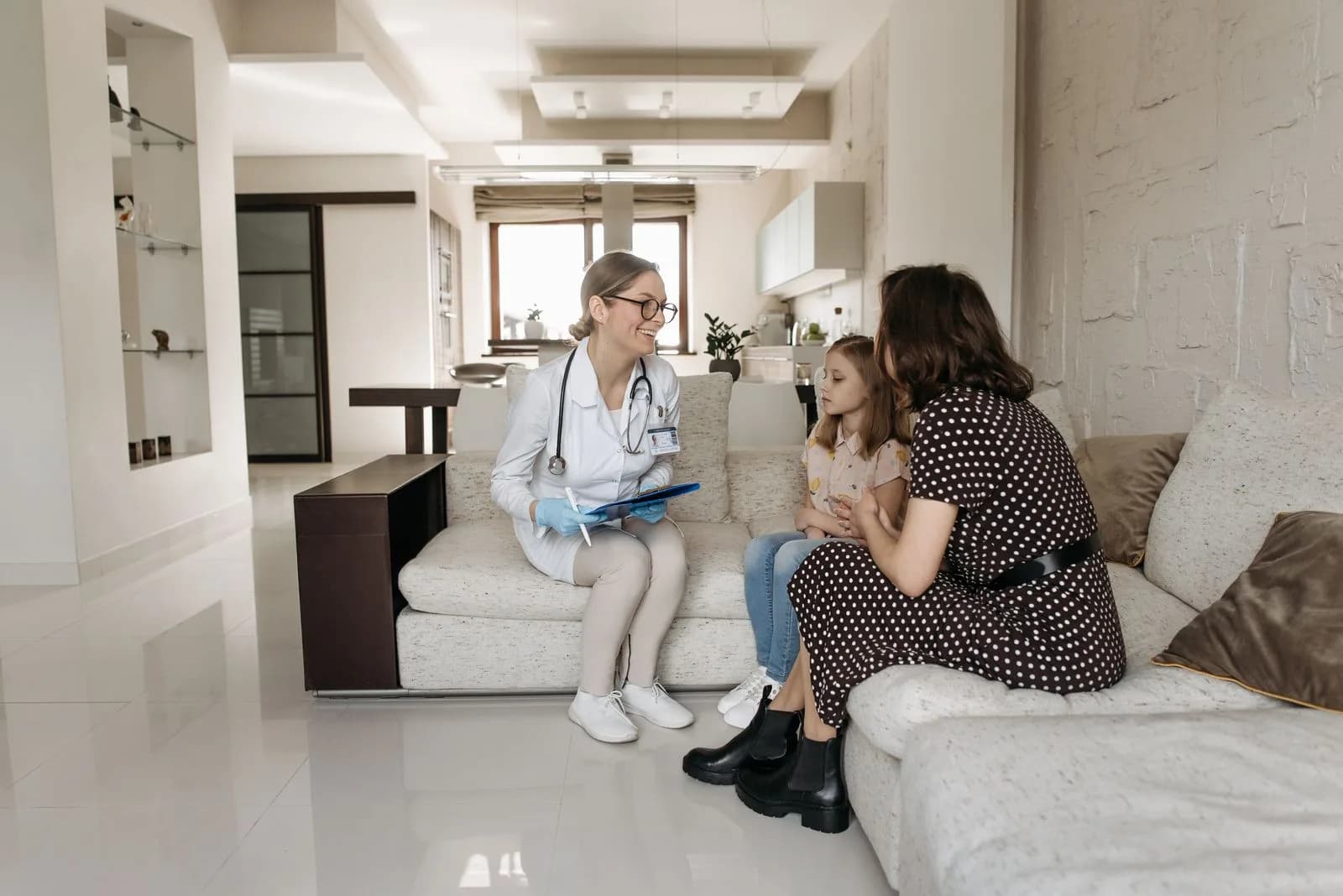 Dr. Chavira with a patient at home